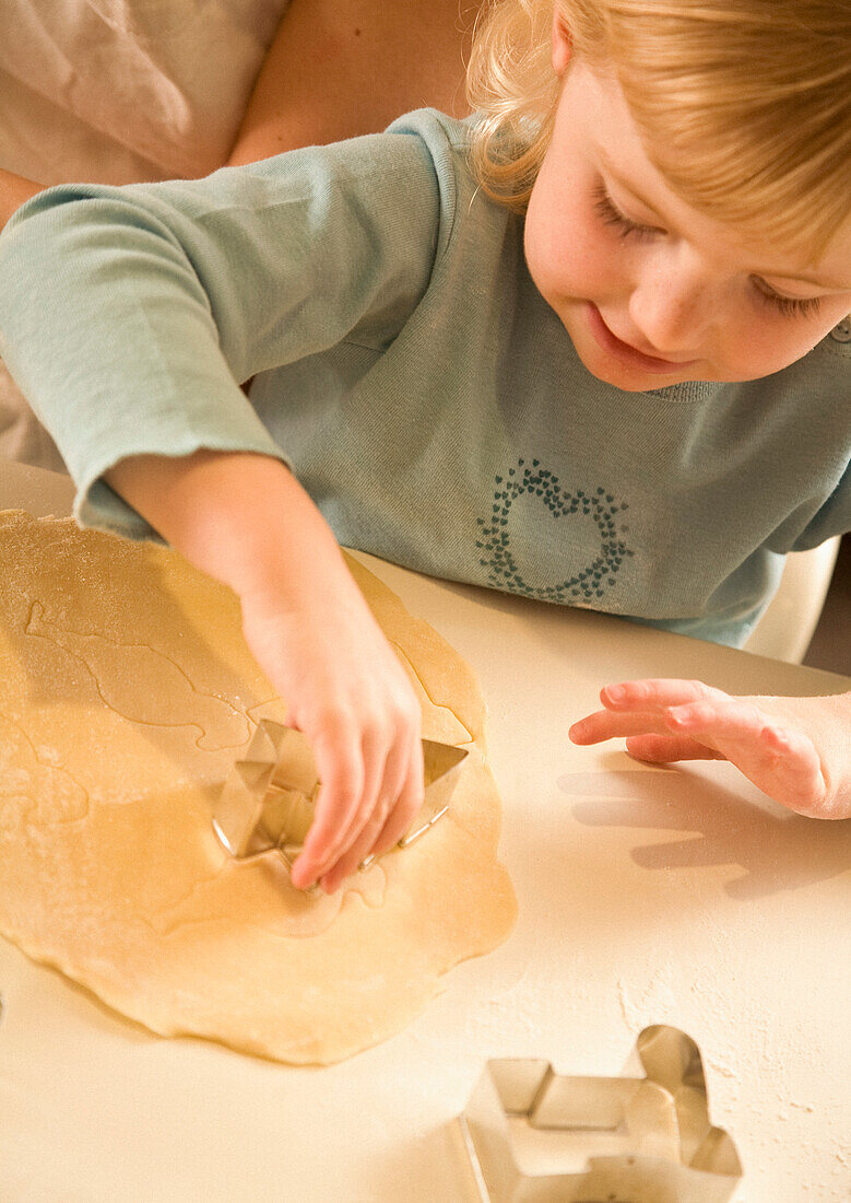 Young girl baking in kitchen\n