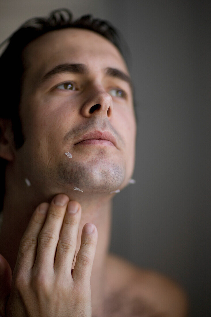 Young man with razor cuts\n