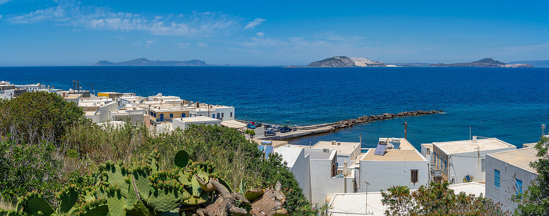 View of rooftops and the sea in the town of Mandraki, Mandraki, Nisyros, Dodecanese, Greek Islands, Greece, Europe\n