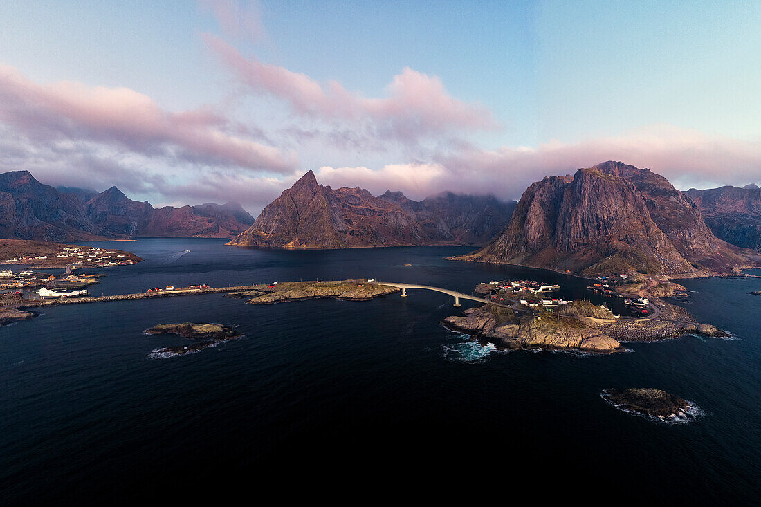 Aerial view of mountains and sea surrounding the fishing village of Hamnoy, Reine, Lofoten Islands, Nordland, Norway, Scandinavia, Europe\n