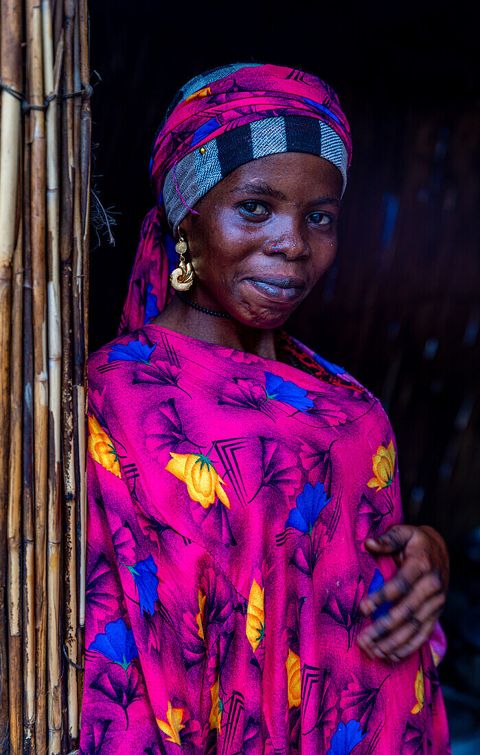 Portrait of a local woman in bright pink clothes, Lake Chad, Chad, Africa\n