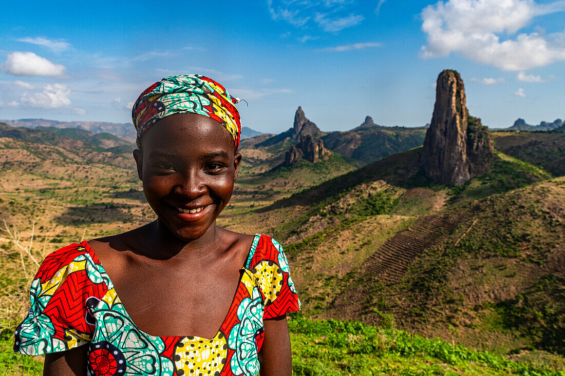 Kapsiki tribal girl in front of the lunar landscape of Rhumsiki , Rhumsiki, Mandara mountains, Far North province, Cameroon, Africa\n