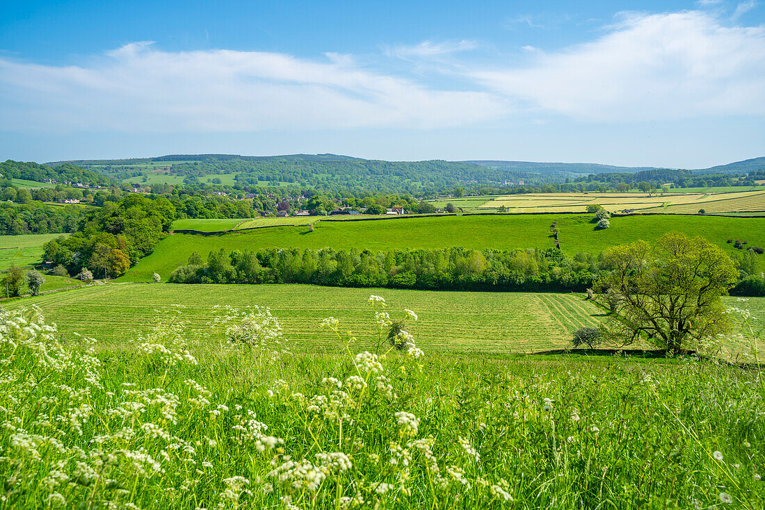View of farmland and Baslow village during spring, Peak District National Park, Derbyshire, England, United Kingdom, Europe\n