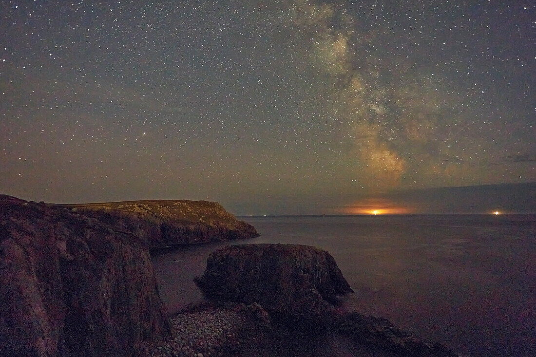 An autumn view of the Milky Way over the Atlantic Ocean, seen from the cliffs of Land's End, the most southwesterly point of Great Britain, Cornwall, England, United Kingdom, Europe\n