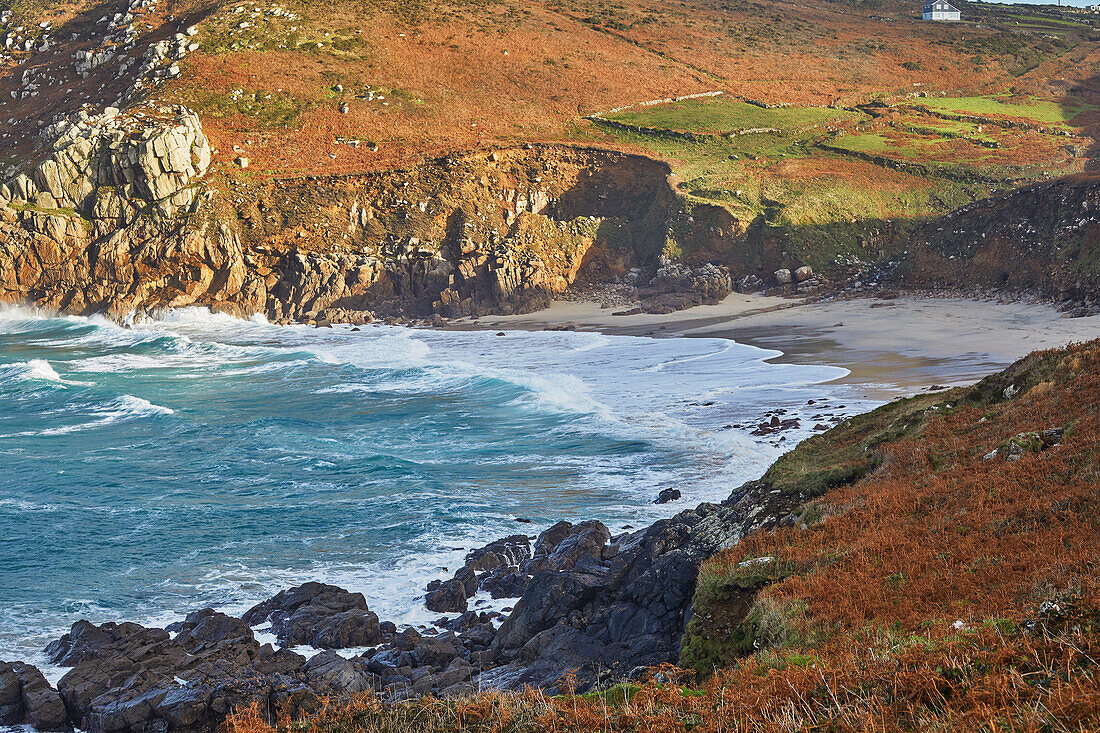 The cliffs and sands of Portheras Cove, a remote beach near Pendeen, on the rugged Atlantic cliffs of the far west of Cornwall, England, United Kingdom, Europe\n