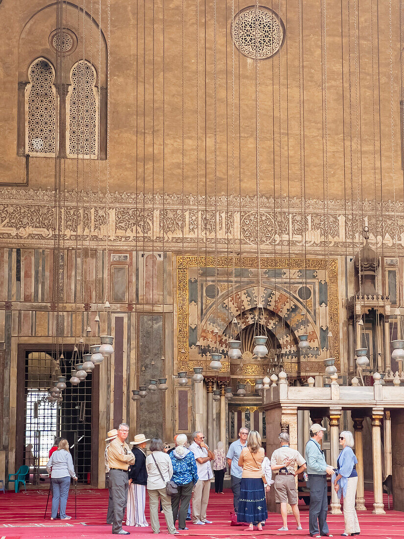 Tourists at the Mosque of Sultan Hassan, built between 1356 and 1363 during the Bahri Mamluk period, Cairo, Egypt, North Africa, Africa\n