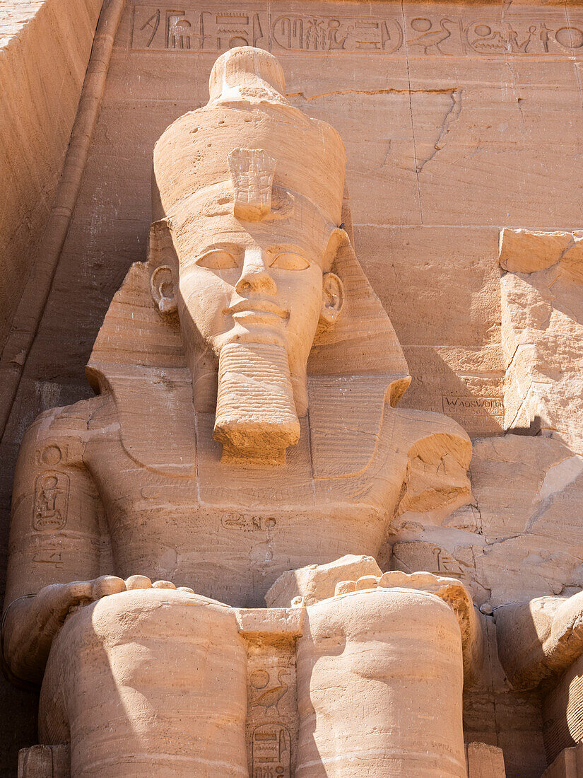 The Great Temple of Abu Simbel with its four iconic 20 meter tall seated colossal statues of Ramses II (Ramses The Great), UNESCO World Heritage Site, Abu Simbel, Egypt, North Africa, Africa\n