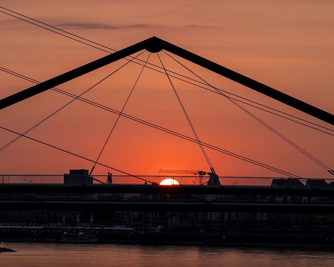 Sunrise behind Rheinkniebrucke, Medienhafen, Dusseldorf, North Rhine-Westphalia, Germany, Europe\n