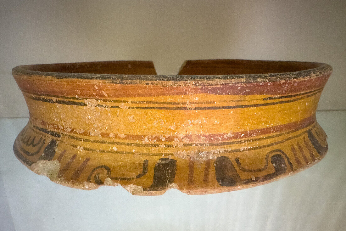 Frament of a Mayan ceramic pot in the visitors center museum in the Cahal Pech Archeological Reserve in San Ignacio, Belize.\n