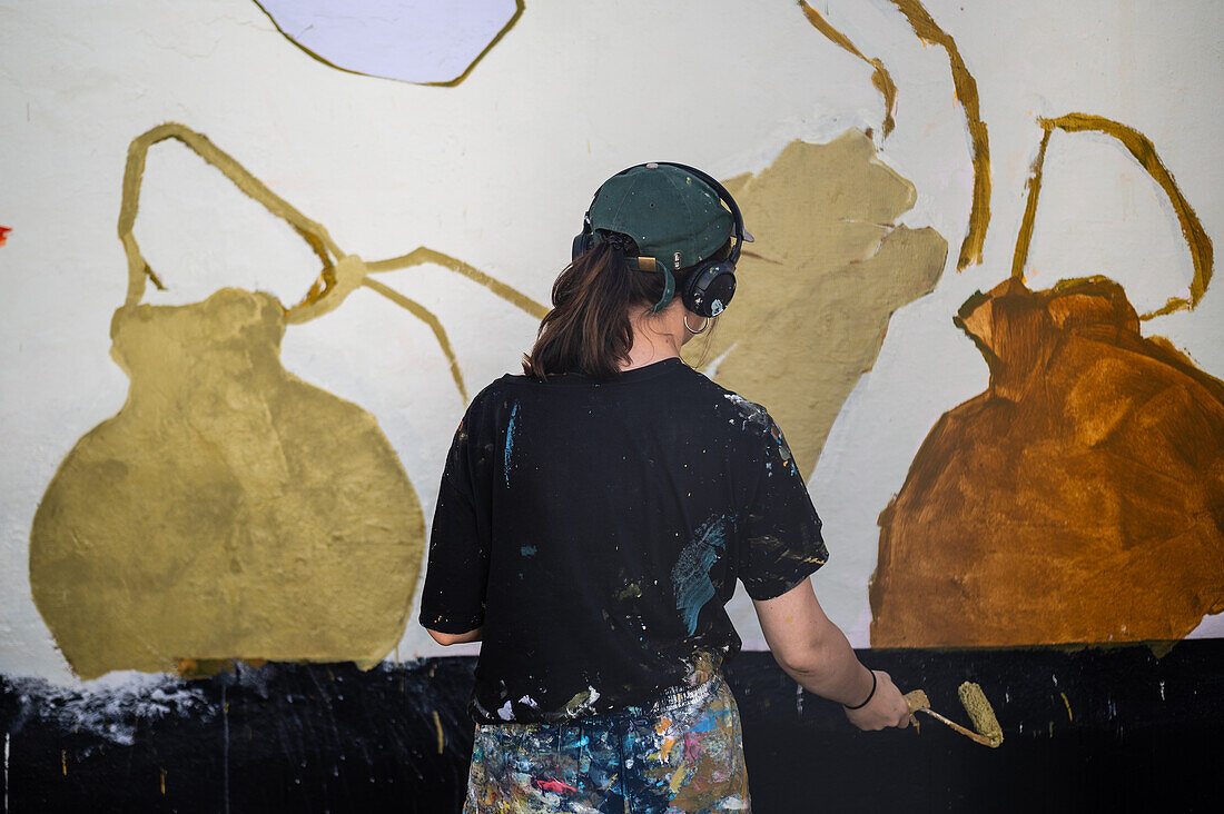 Finnish artist Anetta Lukjanova working at Asalto International Urban Art Festival in Zaragoza, Spain\n