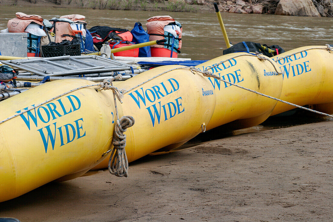 White water rafts tied up on shore in Desolation Canyon, Utah.\n