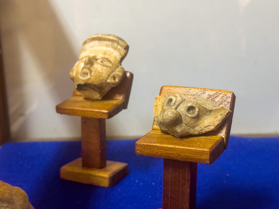 Mayan ceramic figurines in the visitors center museum in the Cahal Pech Archeological Reserve in San Ignacio, Belize.\n