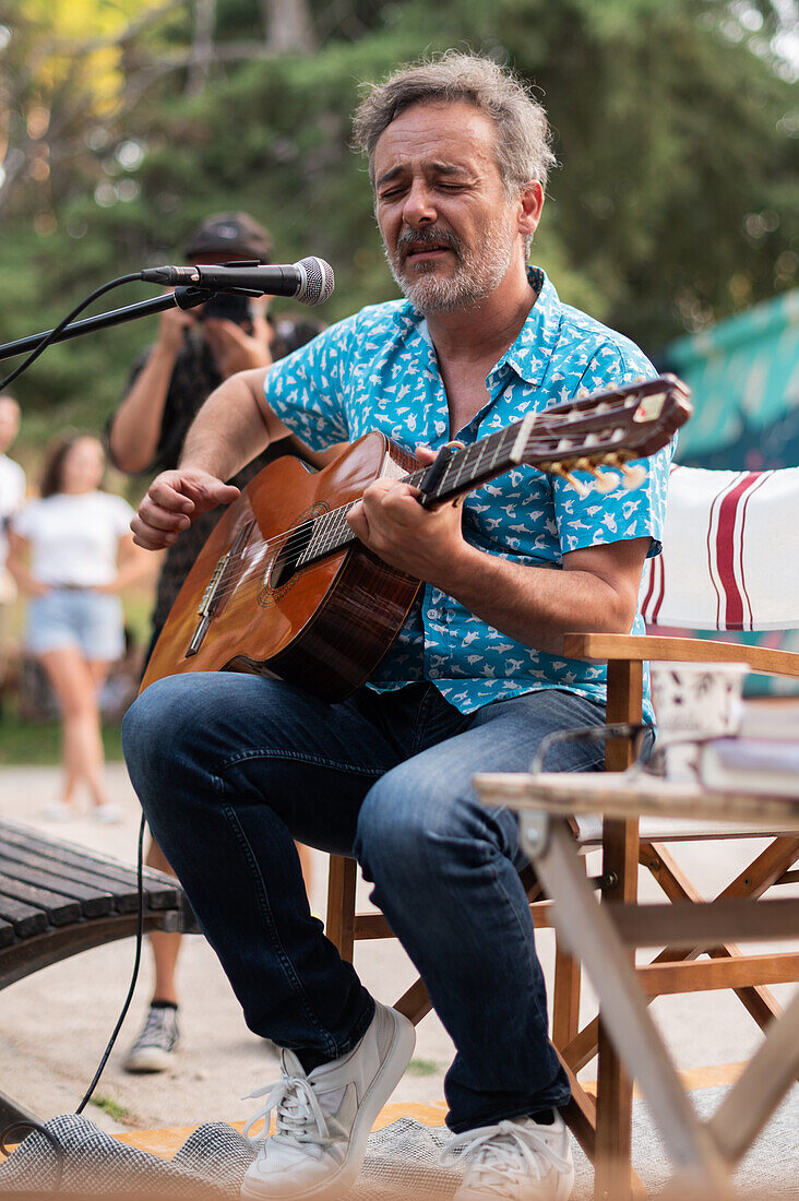 Santi Balmes, Spanish indie-pop musician and writer, front man of the band Love of Lesbian, performs live at El Kiosko de las Letras in Labordeta Park, Zaragoza, Spain\n