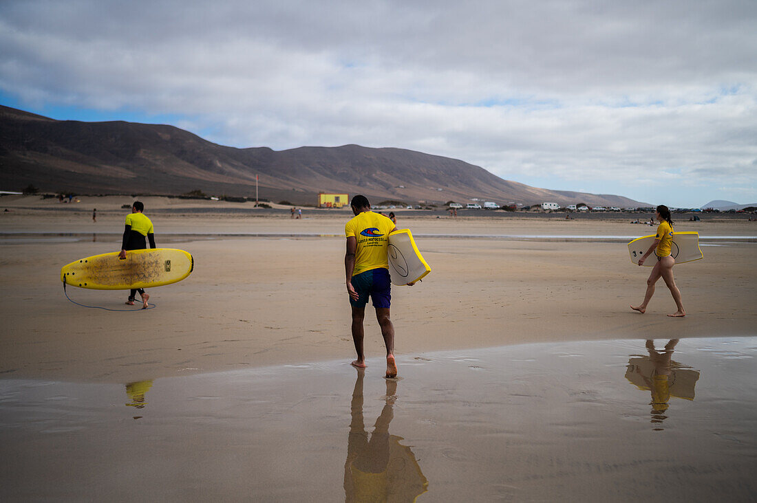 Famara beach (Playa de Famara), 6km golden sand beach located within the Natural Park of the Chinijo Archipelago, between the fishing village of La Caleta de Famara and the base of the impressive cliffs of Famara, Lanzarote, Canary Islands, Spain\n