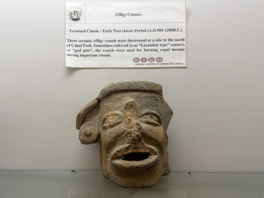 A Mayan ceramic effigy censor in the visitors center museum in the Cahal Pech Archeological Reserve in San Ignacio, Belize.\n