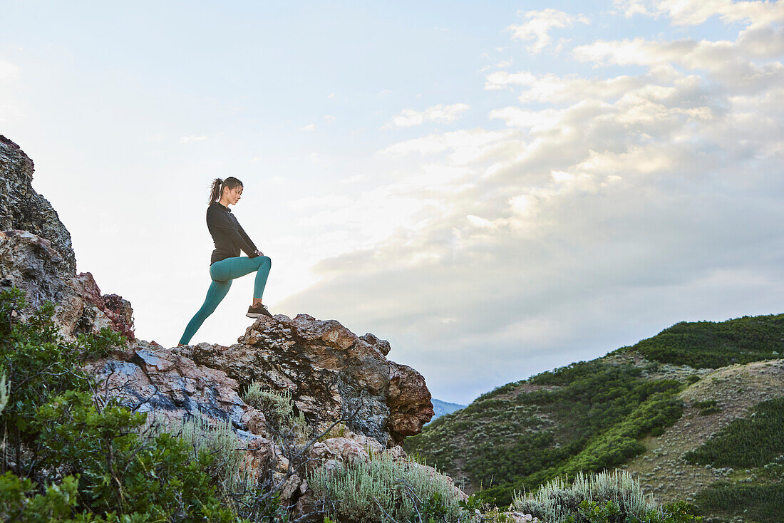 Mid adult woman hiking in mountains\n