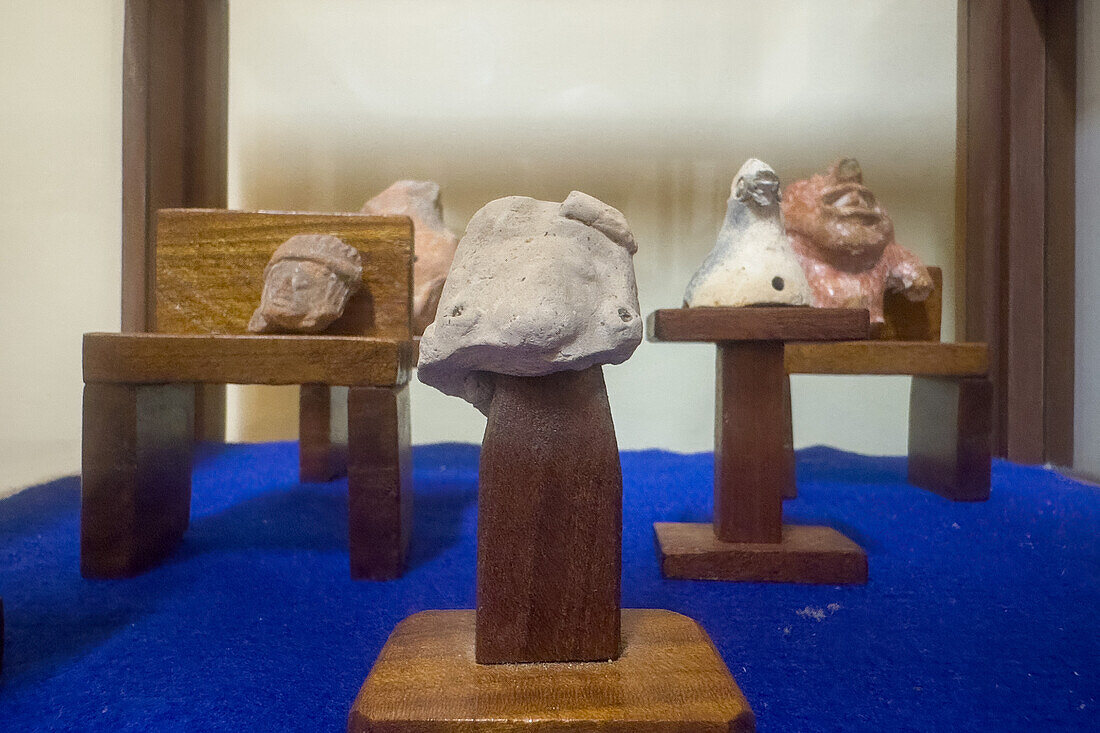 Mayan ceramic figurines in the visitors center museum in the Cahal Pech Archeological Reserve in San Ignacio, Belize.\n