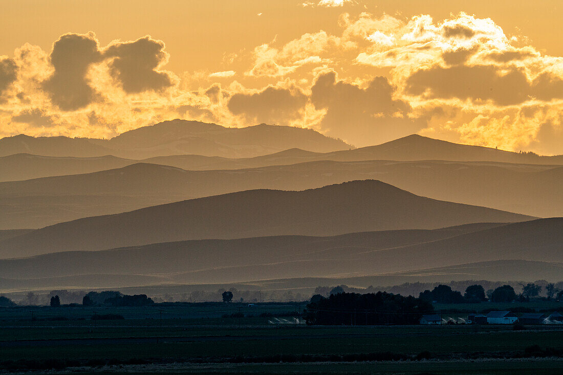 USA, Idaho, Bellevue, Clouds above mountains at sunset\n