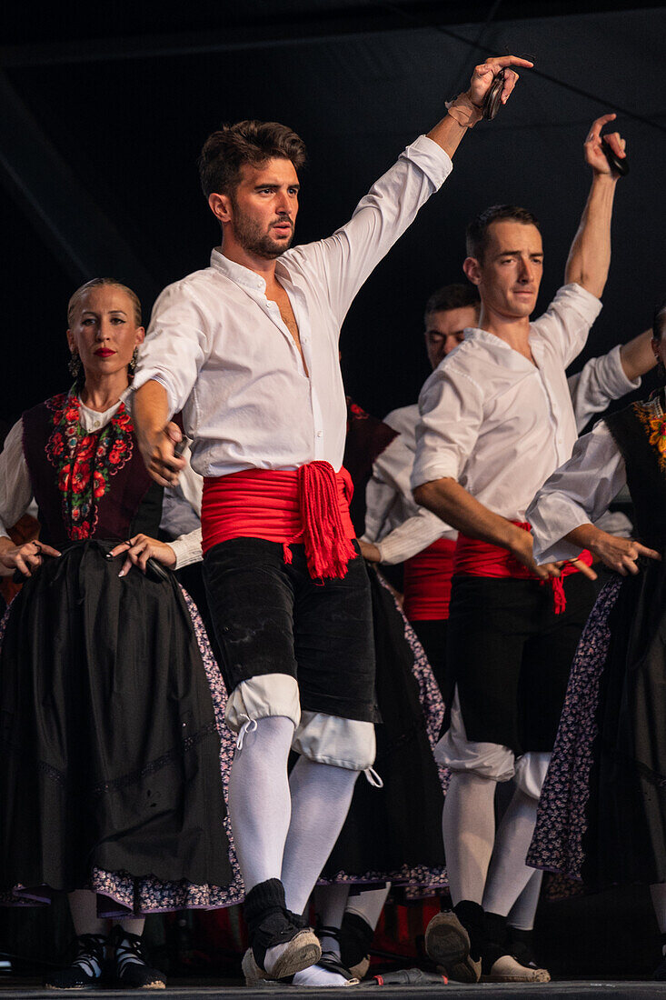 Baluarte Aragones and Raices de Aragon, Aragonese traditional Jota groups, perform in Plaza del Pilar during the El Pilar festivities in Zaragoza, Spain\n