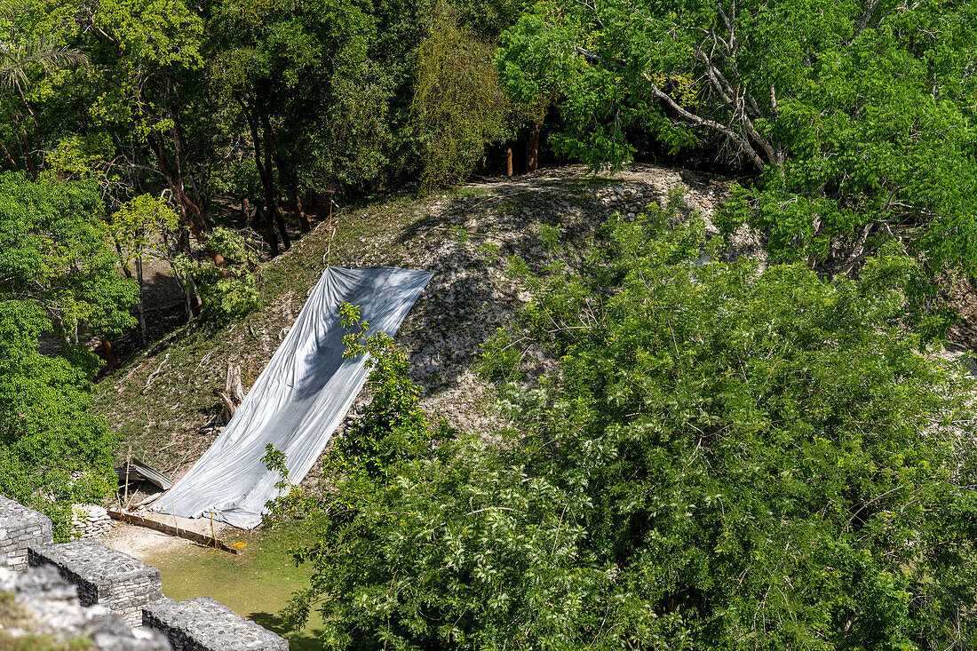 Tarpaulins covering new archeologic excavations on Structure A-7 in the Xunantunich Archeological Reserve in Belize.\n