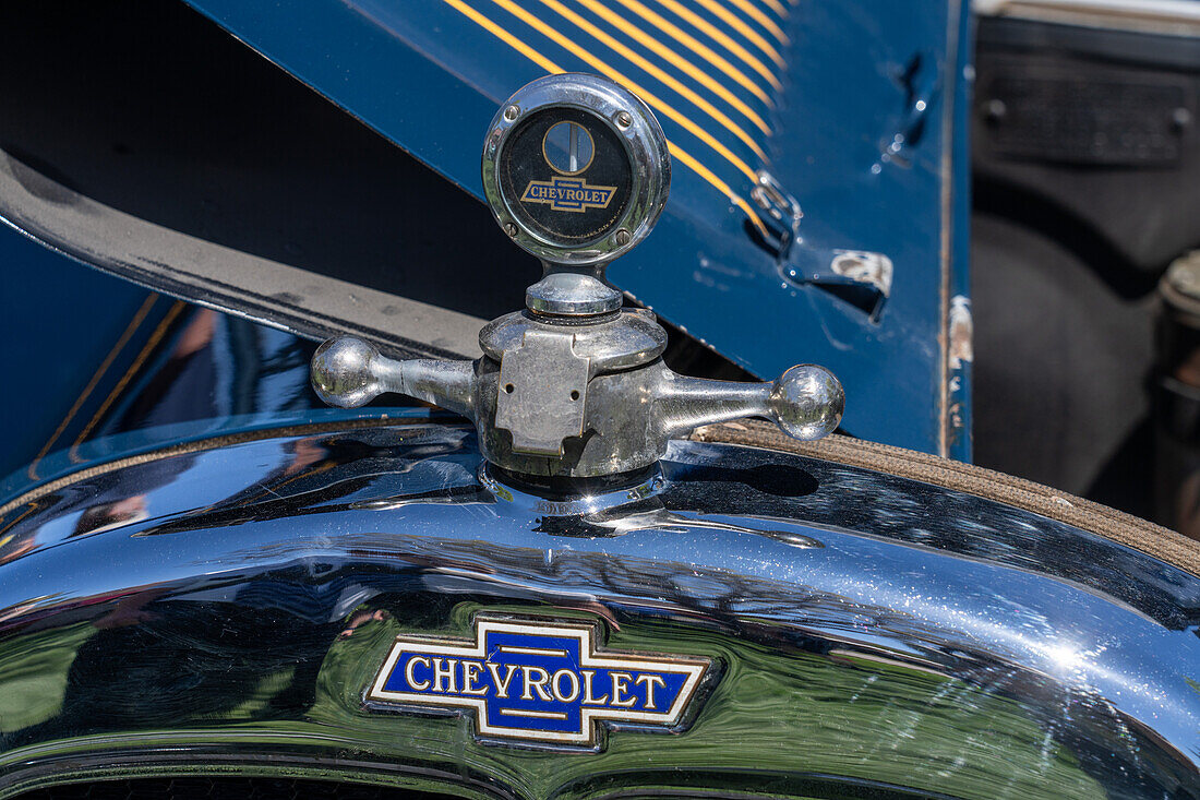 Detail of the hood ornament of a restored vintage 1927 Chevrolet Series AA Capitol sedan in a car show in Moab, Utah.\n