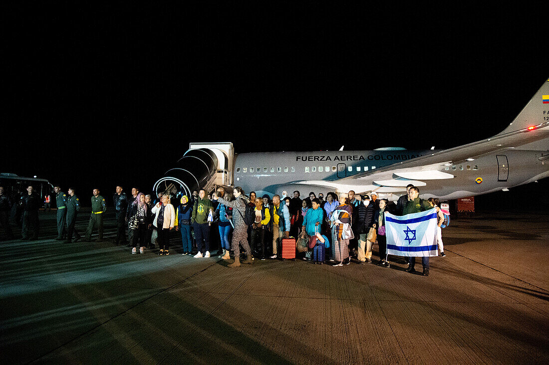 Colombians arrive in a Colombian Aerospacial force (Air Force) humanitarian flight from Tel Aviv, Israel after the Palestinian militant group Hamas made a surprise attack, in Bogota, Colombia, October 13, 2023.\n