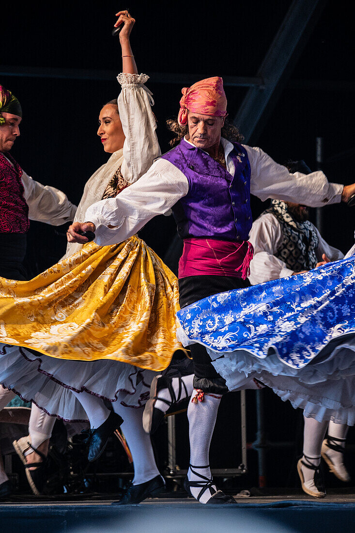 Baluarte Aragones and Raices de Aragon, Aragonese traditional Jota groups, perform in Plaza del Pilar during the El Pilar festivities in Zaragoza, Spain\n