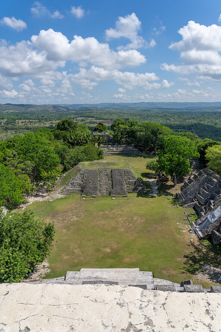 View of pyramids in Plazas A1 & A2 from the top of El Castillo, Structure 6, in the Xunantunich Archeological Reserve in Belize.\n