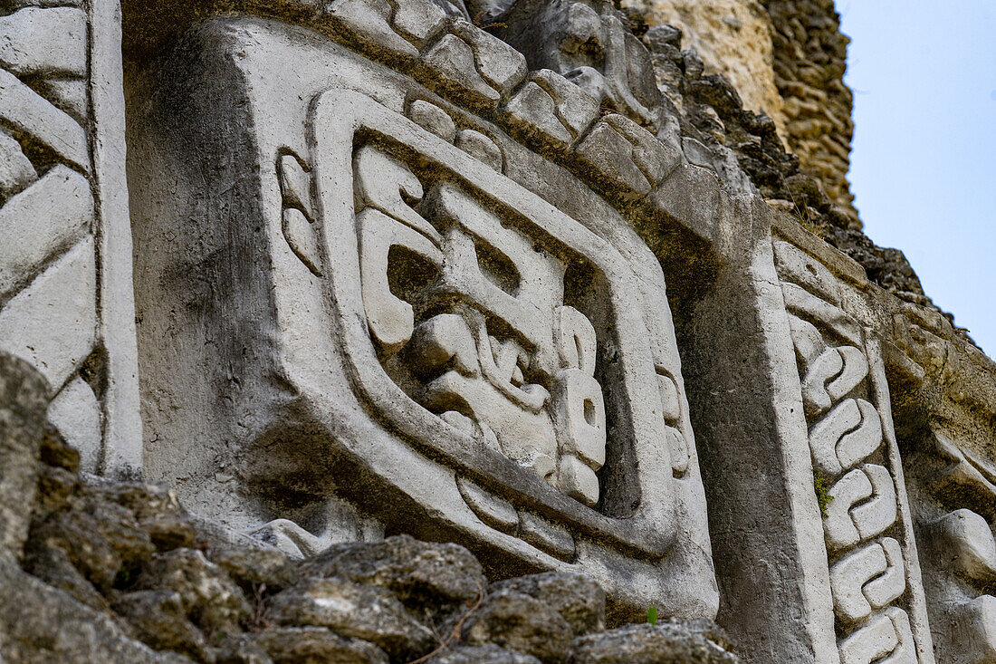 Detail of the west frieze on El Castillo or Structure A-6 in the Mayan ruins of the Xunantunich Archeological Reserve in Belize. This figure is identified as Kawil, an ancestral deity.\n
