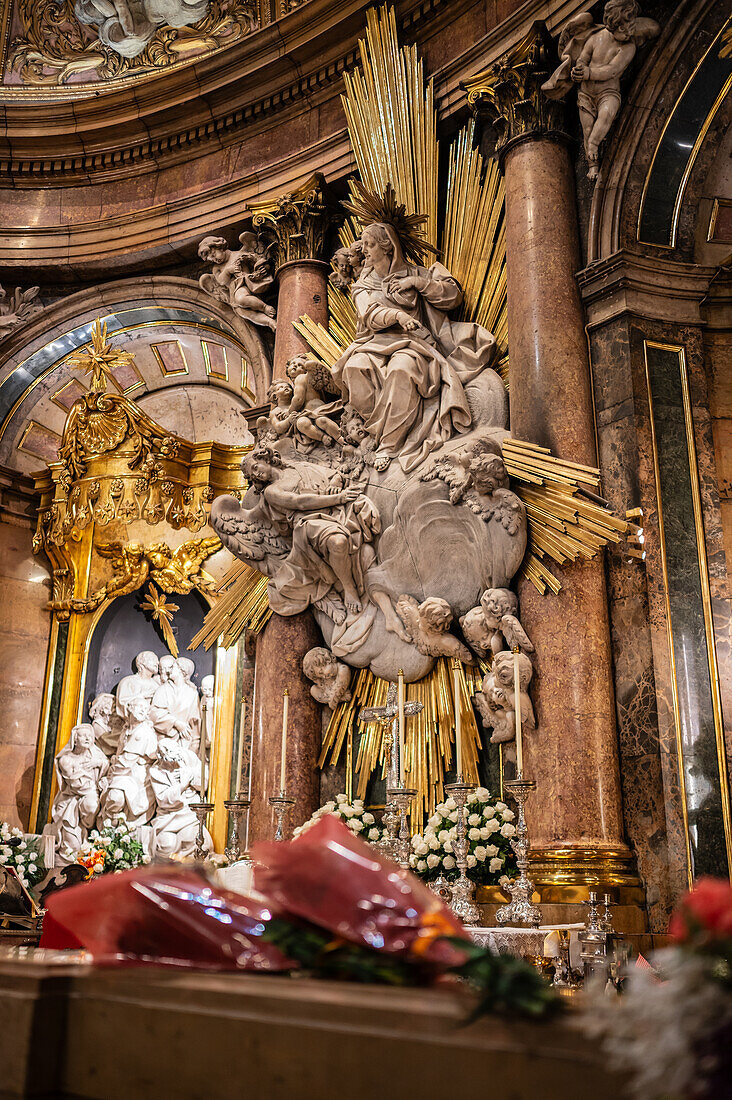 The Virgin of El Pilar inside the Cathedral-Basilica of Our Lady of the Pillar during Hispanic Day, Zaragoza, Spain\n