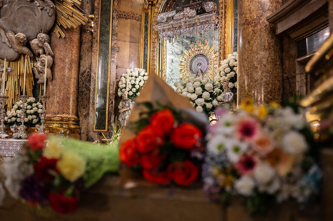 The Virgin of El Pilar inside the Cathedral-Basilica of Our Lady of the Pillar during Hispanic Day, Zaragoza, Spain\n