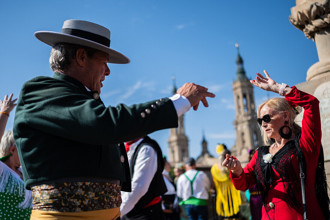 Group from Andalucia dancing sevillanas during The Offering of Fruits on the morning of 13 October during the Fiestas del Pilar, Zaragoza, Aragon, Spain\n