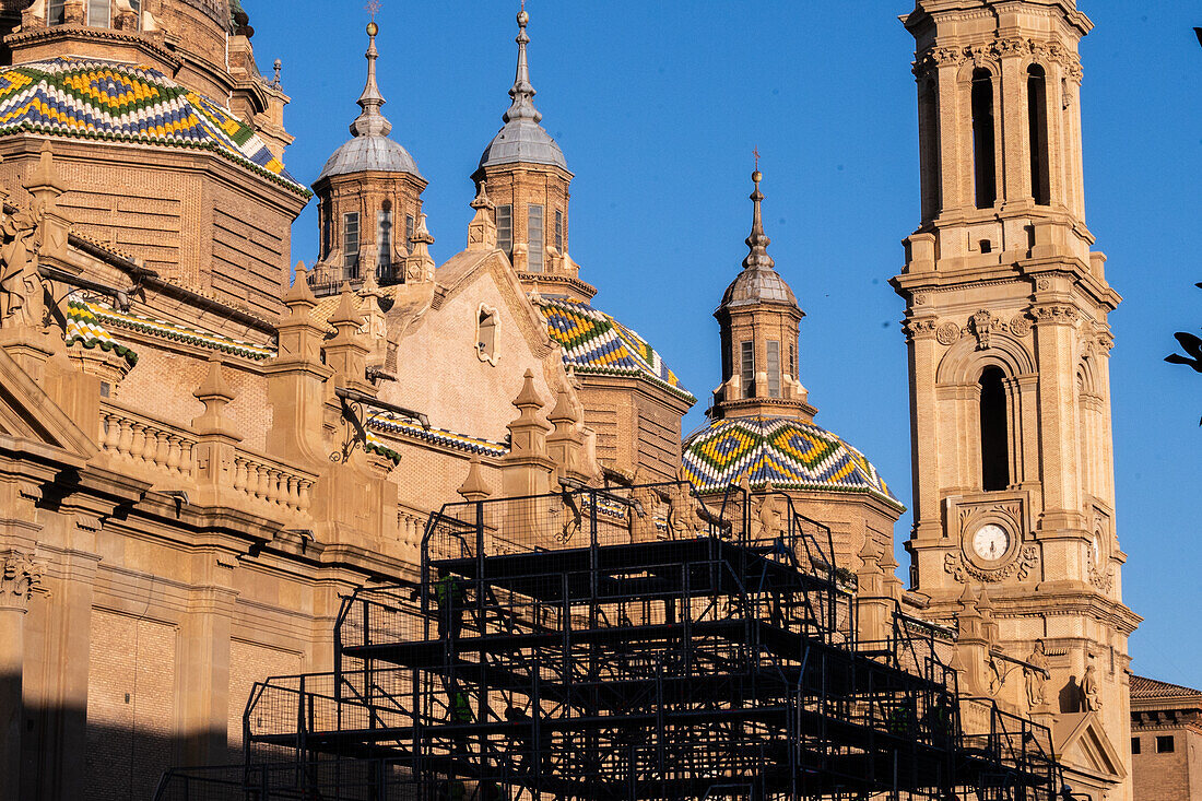 Workers preparing the platform for The Offering of Flowers to the Virgen del Pilar, the most important and popular event of the Fiestas del Pilar held on Hispanic Day, Zaragoza, Spain\n
