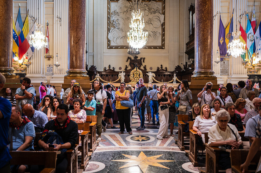 Believers inside the Cathedral-Basilica of Our Lady of the Pillar during The Offering of Flowers to the Virgen del Pilar, the most important and popular event of the Fiestas del Pilar held on Hispanic Day, Zaragoza, Spain\n