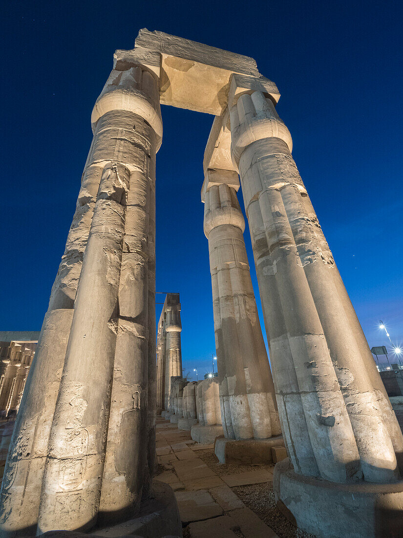 The Luxor Temple at night, a large Ancient Egyptian temple complex constructed approximately 1400 BCE, UNESCO World Heritage Site, Luxor, Thebes, Egypt, North Africa, Africa\n
