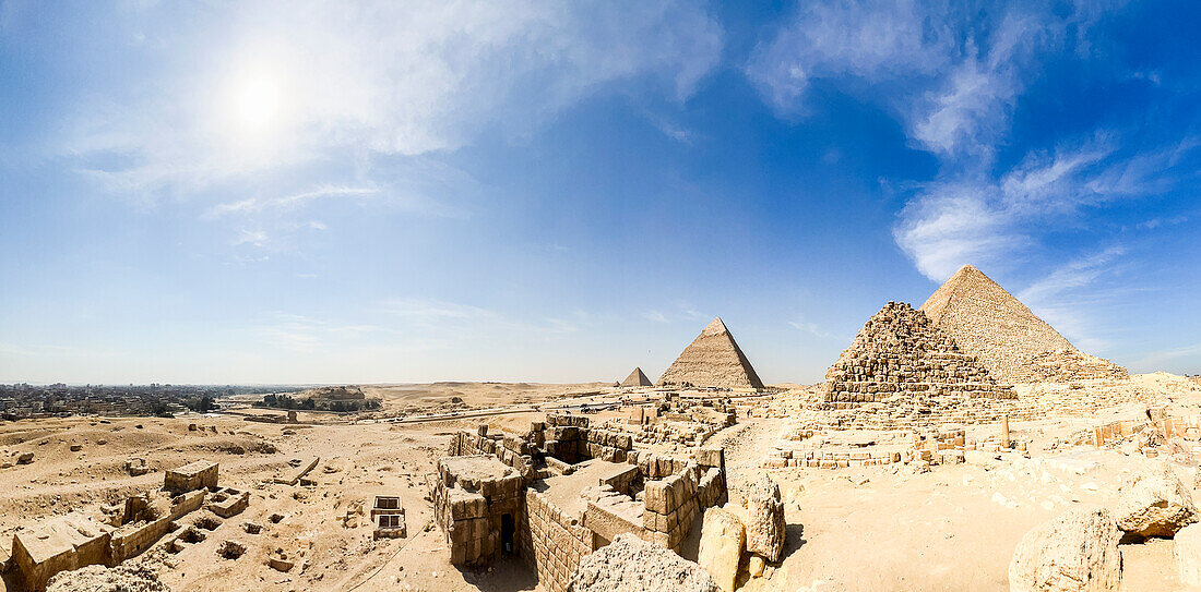 Panoramic view of the Great Pyramid of Giza complex, the oldest of the Seven Wonders of the World, UNESCO World Heritage Site, Giza, Cairo, Egypt, North Africa\n
