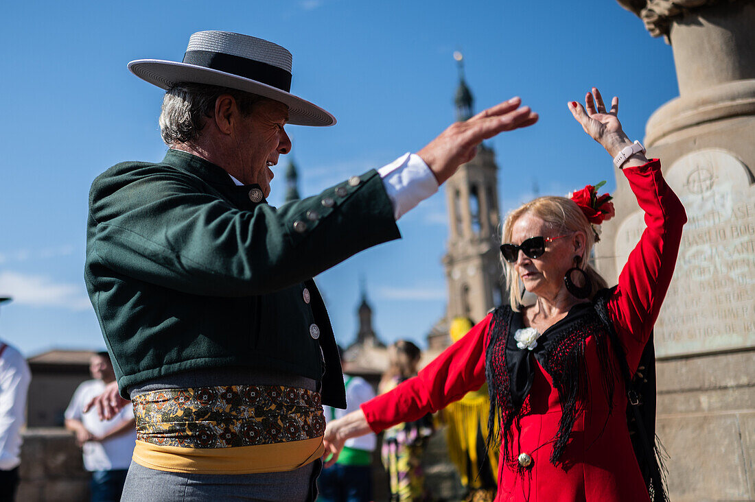 Group from Andalucia dancing sevillanas during The Offering of Fruits on the morning of 13 October during the Fiestas del Pilar, Zaragoza, Aragon, Spain\n