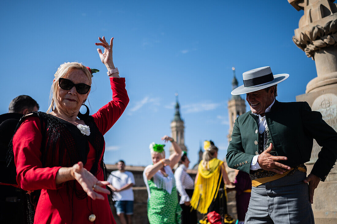 Group from Andalucia dancing sevillanas during The Offering of Fruits on the morning of 13 October during the Fiestas del Pilar, Zaragoza, Aragon, Spain\n