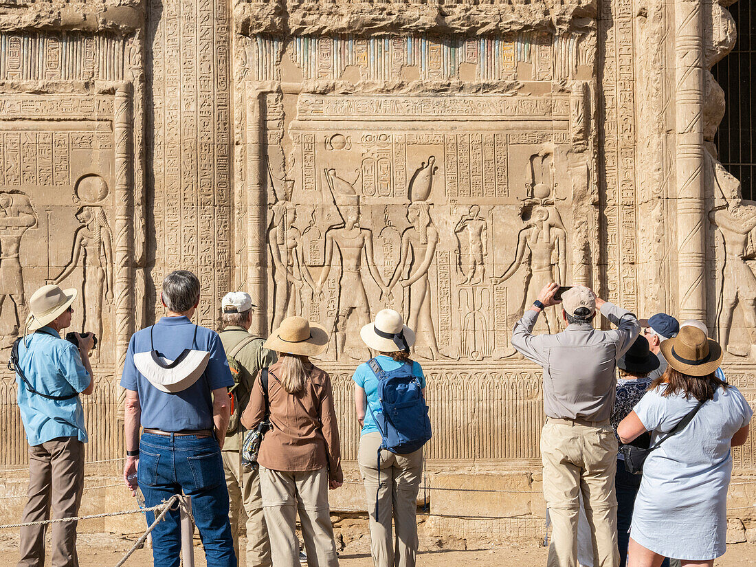 Tourists at the Temple of Hathor, which began construction in 54 BCE, part of the Dendera Temple complex, Dendera, Egypt, North Africa, Africa\n