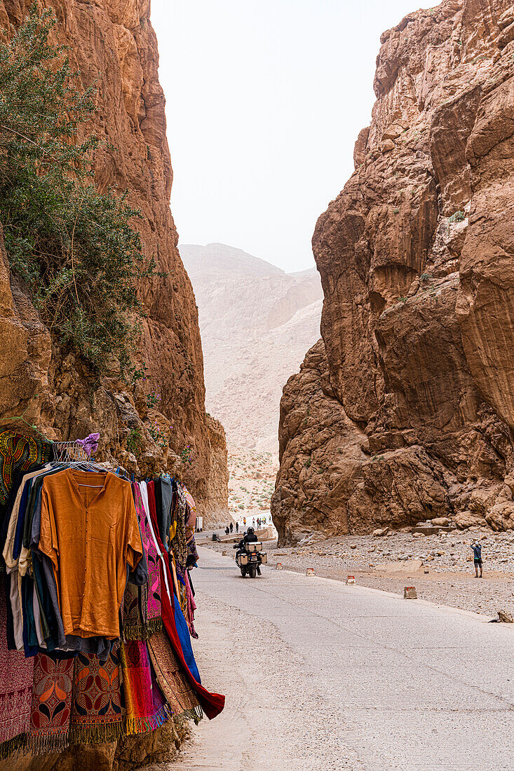 Clothes for sale hanging on rocks at the famous Todra gorges, Tinghir, Atlas mountains, Ouarzazate province, Morocco, North Africa, Africa\n