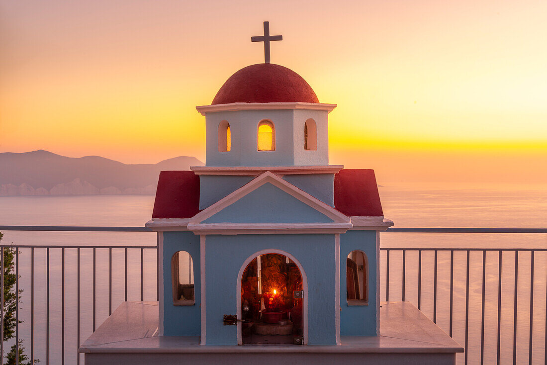 View of miniature Greek Orthodox church on coastal road near Assos, Kefalonia, Ionian Islands, Greek Islands, Greece, Europe\n