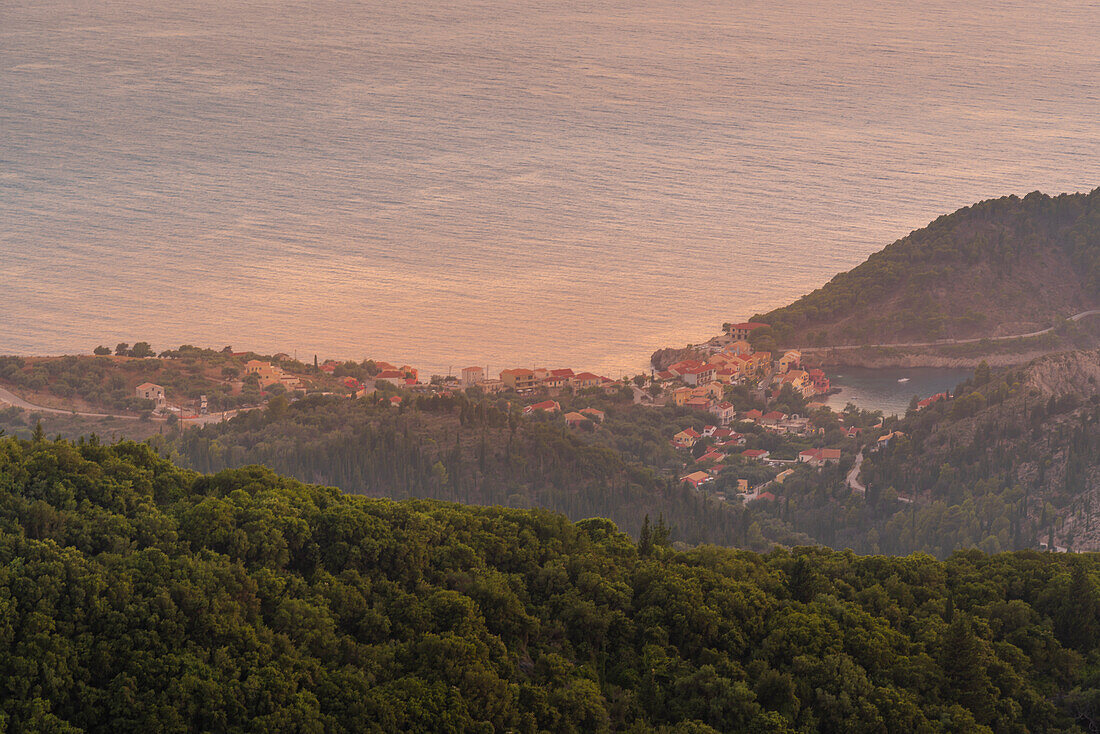 View of Assos, coastline, sea and hills at sunset, Assos, Kefalonia, Ionian Islands, Greek Islands, Greece, Europe\n