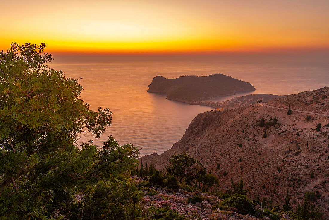 View of Assos, coastline, sea and hills at sunset, Kefalonia, Ionian Islands, Greek Islands, Greece, Europe\n