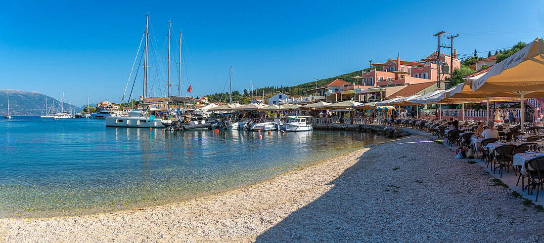 View of cafes and restaurants in Fiscardo harbour, Fiscardo, Kefalonia, Ionian Islands, Greek Islands, Greece, Europe\n