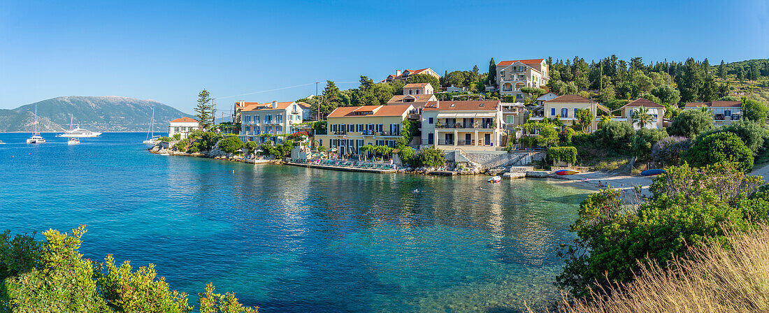 View of hotels overlooking Fiscardo harbour, Fiscardo, Kefalonia, Ionian Islands, Greek Islands, Greece, Europe\n