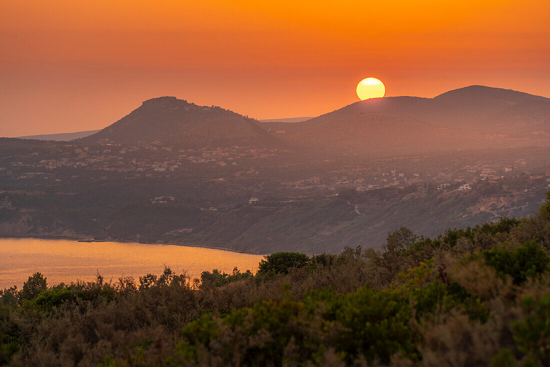 View of coastline near Lourdata at sunset, Kefalonia, Ionian Islands, Greek Islands, Greece, Europe\n