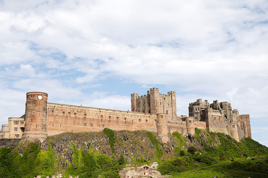 Bamburgh Castle, a hilltop fortress and Grade I Listed Building, Bamburgh, Northumberland, England, United Kingdom, Europe\n