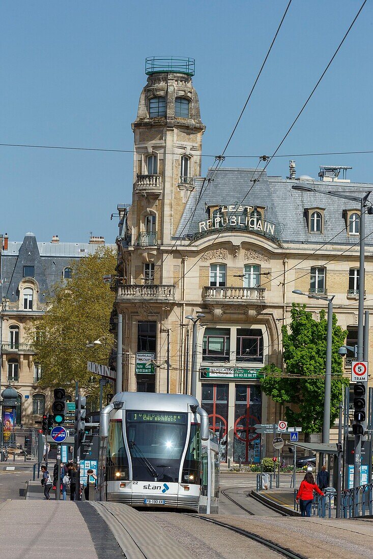 France, Meurthe et Moselle, Nancy, the tramway in the Gare (Train station) district, the tower of former head office of Est Republicain newspaper built in 1912-1913 by architect Pierre le Bourgeois from the nancy school in Art Nouveau style\n