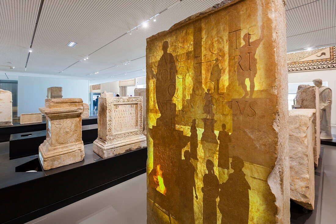 France, Gard, Nimes, Musee de la Romanite by architect Elizabeth de Portzamparc, stone stele with an epigraphy animated by video mapping\n