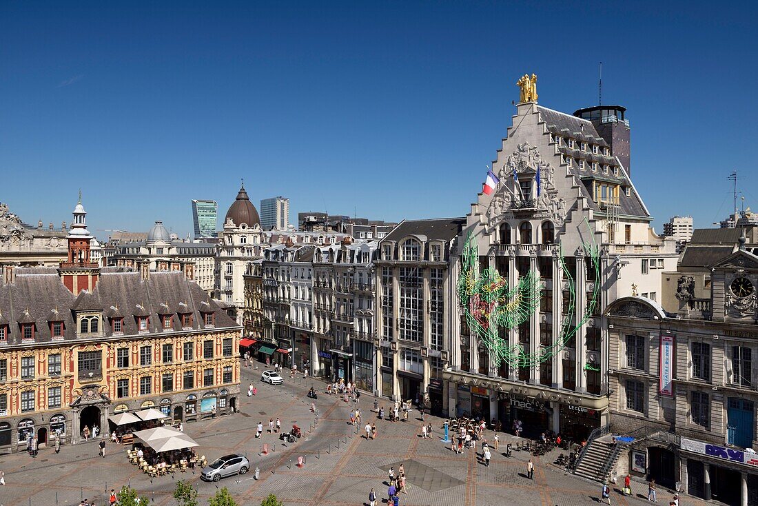 France, Nord, Lille, Place du General De Gaulle or Grand Place, facade of the Voix du Nord building with a drawing as part of the Lille 3000 Eldorado exhibition next to the Théâtre du Nord and in front of the old stock exchange\n